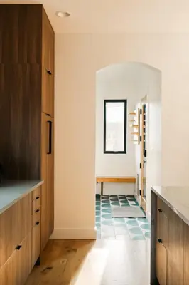 a kitchen with white walls and a blue tile floor at Colorful Sunnyside Escape - Walk to Dining & Parks in Denver