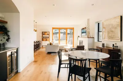 a kitchen and dining room with a table and chairs at Colorful Sunnyside Escape - Walk to Dining & Parks in Denver