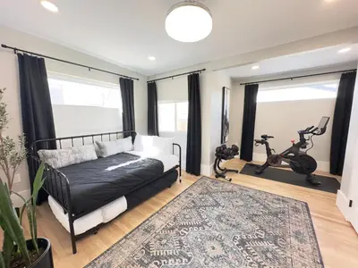 a living room with a couch and a gym at NEW REMODEL Denver Luxury Home with Private HOT TUB in Denver