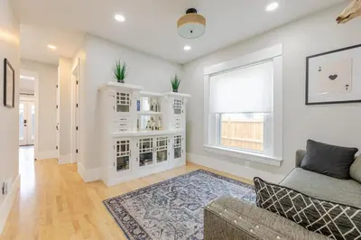 a living room with a couch and a window at NEW REMODEL Denver Luxury Home with Private HOT TUB in Denver