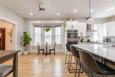 a kitchen with a table and chairs in a room at NEW REMODEL Denver Luxury Home with Private HOT TUB in Denver