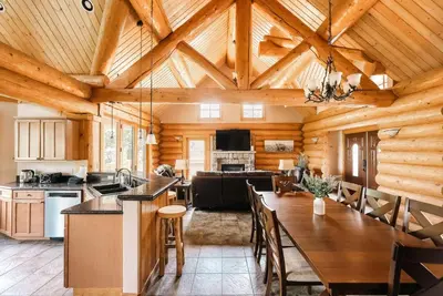 a kitchen and dining room in a log cabin at Ski Hike Relax - Log Cabin with Views - Hot tub in Silverthorne