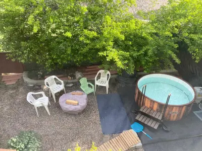 an overhead view of a patio with chairs and a pool at Sunny and Spacious, Hottub, Piano, Guitars, Fenced Yard, Pets Welcome, LGBT Friendly in Westminster