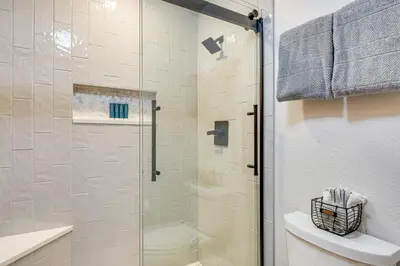 a bathroom with a glass shower with a toilet at Ski and Adventure Base Mtn-View Silverthorne Condo in Silverthorne