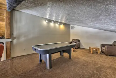 a ping pong table in a room with a ping pong ball at Ski and Adventure Base Mtn-View Silverthorne Condo in Silverthorne