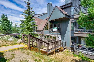 a home with a deck and a house at Ski and Adventure Base Mtn-View Silverthorne Condo in Silverthorne