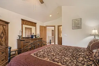a bedroom with a bed and a dresser at Highland Greens 42 in Breckenridge