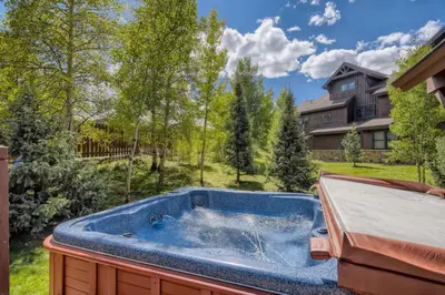 a hot tub sitting on top of a yard at Highland Greens 42 in Breckenridge