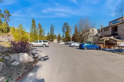 a street with cars parked on the side of the road at Quicksilver 1654 in Keystone