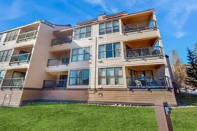 a tall building with balconies on the side of it at Quicksilver 1654 in Keystone