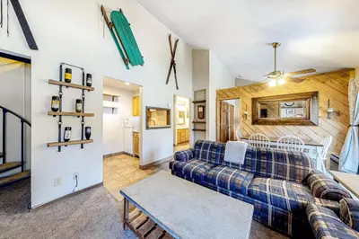 a living room with a couch and a table at Flying Dutchman 1202 in Keystone