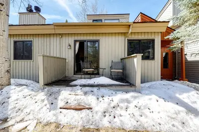 a house with a patio in the snow at Flying Dutchman 1202 in Keystone