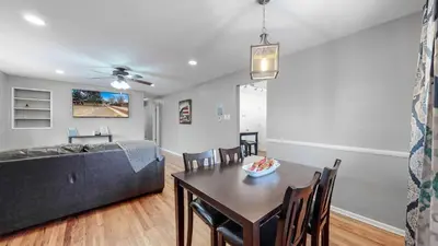 a living room with a table and a couch at Wild West-Inspired Family Home in Denver