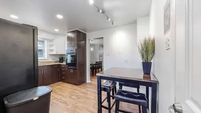 a kitchen with a table with a vase on it at Wild West-Inspired Family Home in Denver
