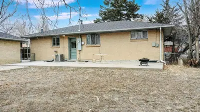 a house with a picnic table in front of it at Wild West-Inspired Family Home in Denver