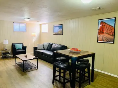 a living room with a couch and a table at Wild West-Inspired Family Home in Denver