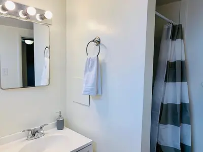 a bathroom with a sink and a mirror at Wild West-Inspired Family Home in Denver