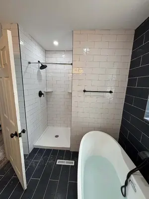 a bathroom with a shower and a tub and a toilet at Entire Family Home in Denver in Denver