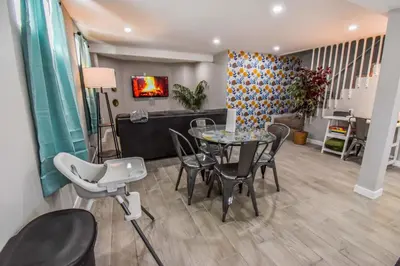 a dining room with a table and chairs at Entire Family Home in Denver in Denver