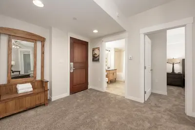 an empty hallway with a door and a mirror at Premium Unit 4663 - One Bedroom withFull Kitchen - Fraser Crossing Founders Pointe condo in Winter Park
