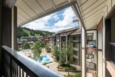 a balcony with a view of a resort at Premium Unit 4663 - One Bedroom withFull Kitchen - Fraser Crossing Founders Pointe condo in Winter Park