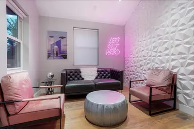 a living room with a couch and two chairs at Good Vibe Tribe-2 Mi DT-Hot Tub-K Bed-Pet Friendly in Denver