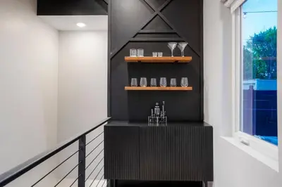 a black bar in a room with a window at Good Vibe Tribe-2 Mi DT-Hot Tub-K Bed-Pet Friendly in Denver