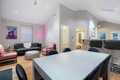 a living room with a table and chairs at Good Vibe Tribe-2 Mi DT-Hot Tub-K Bed-Pet Friendly in Denver