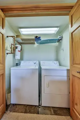 a laundry room with two washer and dryer at Mountain Bliss 3 BR Retreat With Views and Hot Tub in Tabernash