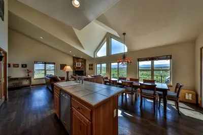 a large kitchen and dining room with a table and chairs at Mountain Bliss 3 BR Retreat With Views and Hot Tub in Tabernash