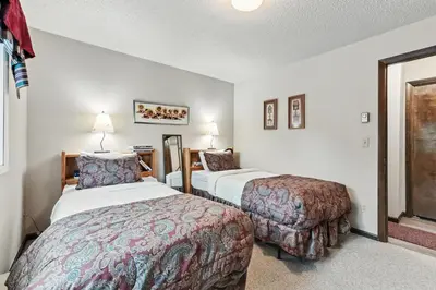 a hotel room with two beds and a bed and a bedskirts at Meadow Creek Retreat Near Trails and Downtown in Frisco