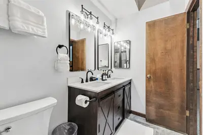 a bathroom with a sink and a toilet and a mirror at Meadow Creek Retreat Near Trails and Downtown in Frisco
