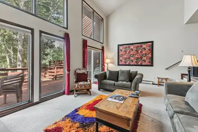 a living room with a couch and a table at Meadow Creek Retreat Near Trails and Downtown in Frisco