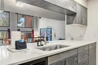 a kitchen with a sink and some windows at Meadow Creek Retreat Near Trails and Downtown in Frisco