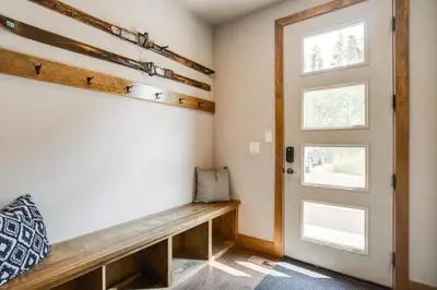 a room with a bench and a door at 2 Mi to Fraser River Trail Townhome with Hot Tub! in Fraser