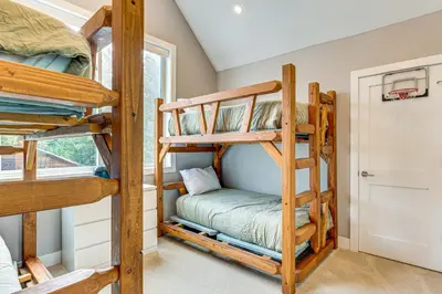 a bedroom with bunk beds in a house at Ski-InandSki-Out Gemini Lift Access! Home with Hot Tub in Winter Park
