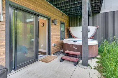 a bath tub sitting next to a building with a bath tub at Ski-InandSki-Out Gemini Lift Access! Home with Hot Tub in Winter Park