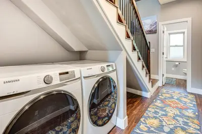 a laundry room with a washer and dryer at Ski-InandSki-Out Gemini Lift Access! Home with Hot Tub in Winter Park