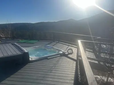 a hot tub sitting on top of a wooden deck at Rancho la Chula - Gambling Golf Hiking Hot Tub! in Black Hawk