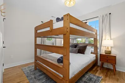 a bedroom with a bunk bed and a window at Denver 5BR Hot Tub, Pool Table, Ping Pong! in Denver