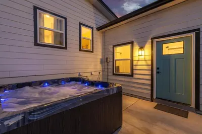 a jacuzzi tub on the side of a house at Denver 5BR Hot Tub, Pool Table, Ping Pong! in Denver