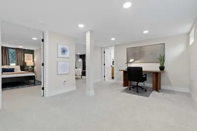 a living room with a desk and a bedroom at Denver 5BR Hot Tub, Pool Table, Ping Pong! in Denver