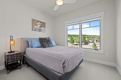 a bedroom with a bed and a large window at 78311 US HWY 40 Unit 6 in Winter Park