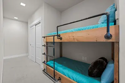 a bedroom with two bunk beds in a room at 78311 US HWY 40 Unit 6 in Winter Park