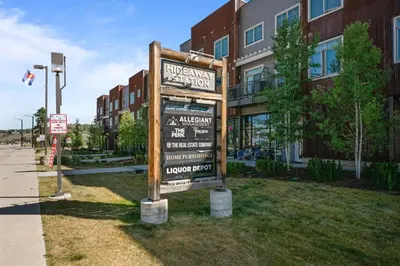 a sign in the grass in front of a building at 78311 US HWY 40 Unit 6 in Winter Park