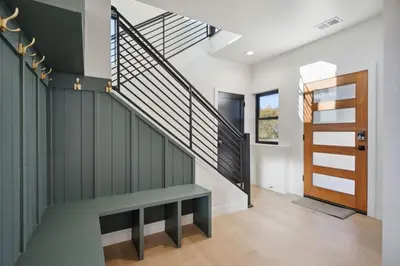 a staircase with a bench and a stair case at Modern Mtn Escape! Hot Tub Fireplace Views! in Bailey