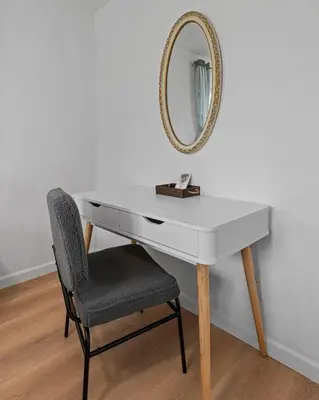 a white desk with a chair and a mirror at Lake Arbor Family Retreat with Backyard Oasis in Arvada