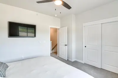 a bedroom with a bed and a flat screen tv at Granby Ranch Escape Shuttle to the Slopes! in Granby