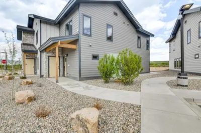 a home with a gray house with a driveway at Granby Ranch Escape Shuttle to the Slopes! in Granby