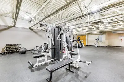 a gym with several tread machines in a room at 2 Mi to Winter Park Slopes Mtn-View Condo! in Winter Park